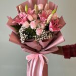 Pink Beauty bouquet with pink lilies, roses, and fillers in Dubai