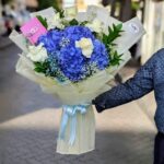 Heavenly Blue Hydrangea Bouquet with 4 hydrangeas, 5 white roses, and seasonal filler - Dubai.