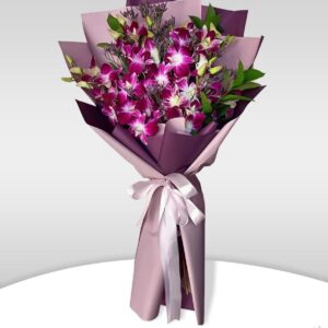 Cinderella Surprise - 10 purple orchids with seasonal fillers wrapped in white ribbon