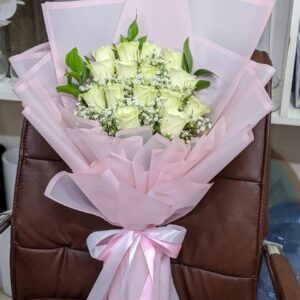 Peaceful Blessing – 15 white roses bouquet with gypsophila, wrapped in pink paper with a white ribbon in Dubai