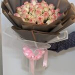 Charming Love – 20 double-shade roses bouquet wrapped in brown paper with pink ribbon in Dubai